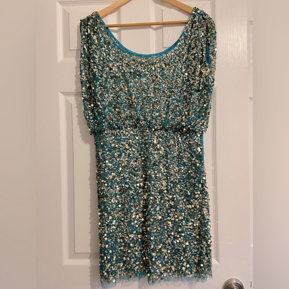 Teal and gold sequin dress with scoop neckline and cap draped shoulder.
